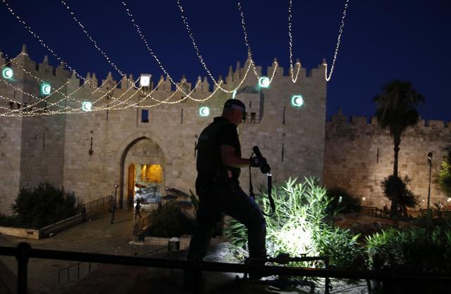 A member of the Israeli security forces outside Damascus Gate in Jerusalem's Old City on June 16, 2017 following an attack. An Israeli policewoman was stabbed and killed in the attack, police said, with security forces shooting dead three Palestinian assailants. (AFP) A member of the Israeli security forces outside Damascus Gate in Jerusalem's Old City on June 16, 2017 following an attack. An Israeli policewoman was stabbed and killed in the attack, police said, with security forces shooting dead three Palestinian assailants. (AFP)