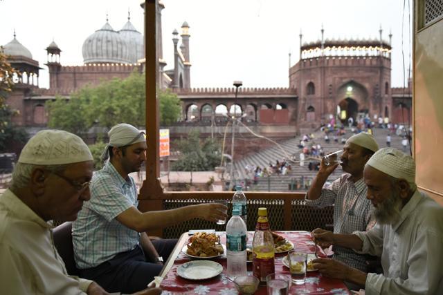 Haji Miyan, Dr Suhail Qureshi, Abdul Nasir and Amiruddin at the iftar meal at Haji Hotel overlooking Jama Masjid in Delhi, India. The ritual extends beyond breaking the fast to coming together with family for Dr Qureshi. (Saumya Khandelwal/HT PHOTO) Haji Miyan, Dr Suhail Qureshi, Abdul Nasir and Amiruddin at the iftar meal at Haji Hotel overlooking Jama Masjid in Delhi, India. The ritual extends beyond breaking the fast to coming together with family for Dr Qureshi. (Saumya Khandelwal/HT PHOTO)