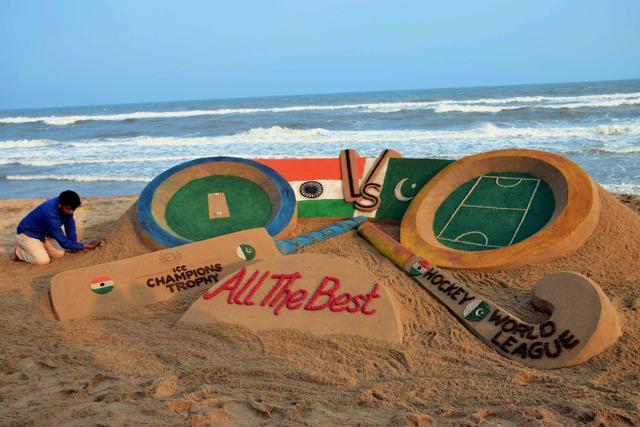 Sand artist Sudarsan Pattnaik makes a sand art in Puri to wish Indian cricket and hockey teams 'all the best' ahead of their matches against Pakistan in London. (PTI) Sand artist Sudarsan Pattnaik makes a sand art in Puri to wish Indian cricket and hockey teams 'all the best' ahead of their matches against Pakistan in London. (PTI)