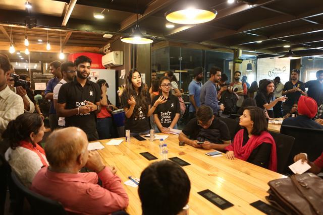 Volunteers of the Human Library engage the readers in a fun activity, as they wait for their session. (Prabhas Roy/HT Photo)
