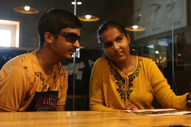 Shubham Singh, a visually-impaired attendee — a student of Class XII — talks to another reader at the event. (Prabhas Roy/HT Photo)