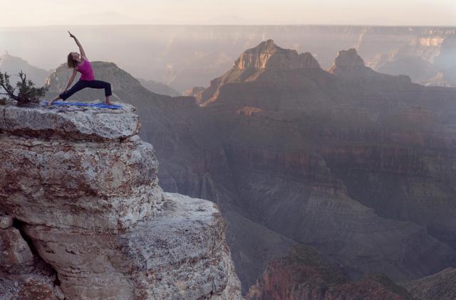 A woman practising yoga on a cliff. (Shutterstock) A woman practising yoga on a cliff. (Shutterstock)