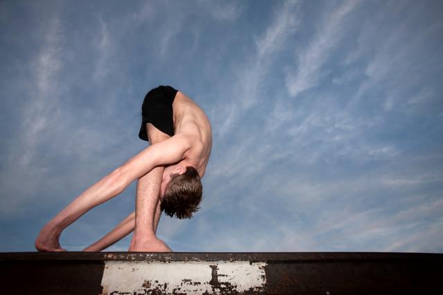 An extremely flexible yoga practitioner on a rail track. (Shutterstock) An extremely flexible yoga practitioner on a rail track. (Shutterstock)