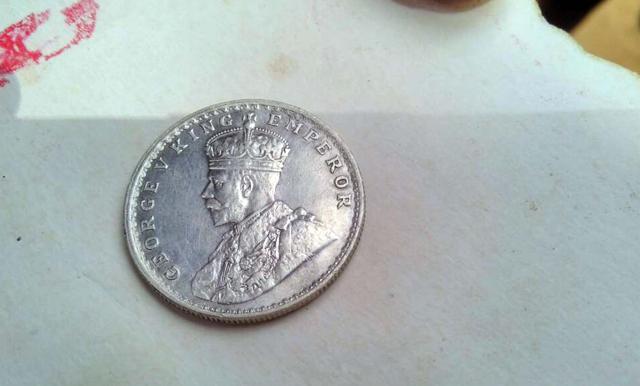 A coin found by villagers in Bharatpur. (HT Photo)