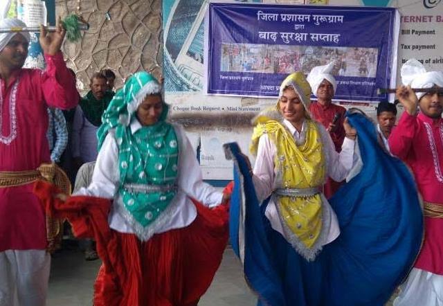 A group of performers stage a street play as part of the Flood Safety Week in Gurgaon. A group of performers stage a street play as part of the Flood Safety Week in Gurgaon.