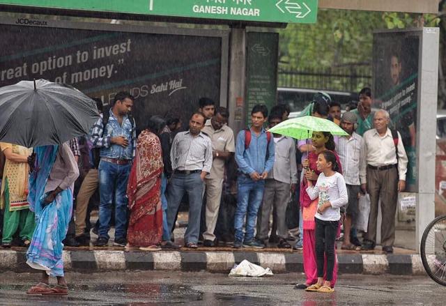 Commuters wait at a bus stop at Laxmi Nagar in New Delhi. (RajkRaj / HT Photo) Commuters wait at a bus stop at Laxmi Nagar in New Delhi. (RajkRaj / HT Photo)