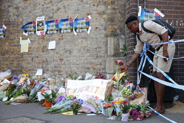 A man leaves flowers beside the police cordon, close to the scene of a van attack in Finsbury Park, north London. (AFP) A man leaves flowers beside the police cordon, close to the scene of a van attack in Finsbury Park, north London. (AFP)