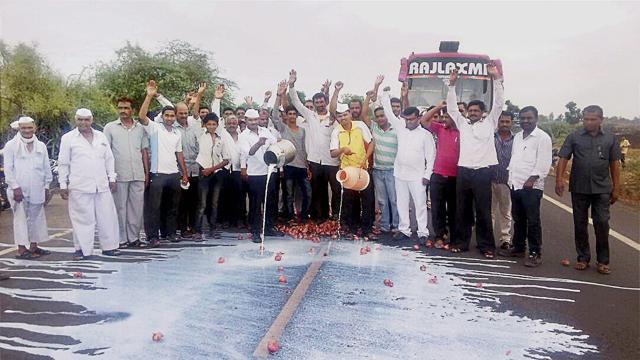 Farmers spill milk on the road during a demonstration protest over various demands in Nasik. (PTI FILE PHOTO) Farmers spill milk on the road during a demonstration protest over various demands in Nasik. (PTI FILE PHOTO)
