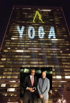 India's Permanent Representative to the UN Syed Akbaruddin and actor Anupam Kher at UN Building in New York lit up with Yoga symbol, ahead of International Day of Yoga on June 19, 2017. (IANS) India's Permanent Representative to the UN Syed Akbaruddin and actor Anupam Kher at UN Building in New York lit up with Yoga symbol, ahead of International Day of Yoga on June 19, 2017. (IANS)