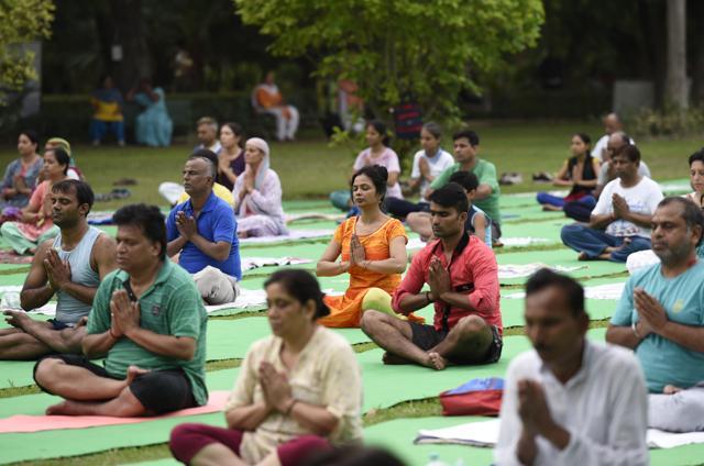 People doing Yoga, preparing for International Yoga Day , at Lodhi Garden in New Delhi, India, on June 18, 2017. (Arvind Yadav/HT PHOTO) People doing Yoga, preparing for International Yoga Day , at Lodhi Garden in New Delhi, India, on June 18, 2017. (Arvind Yadav/HT PHOTO)