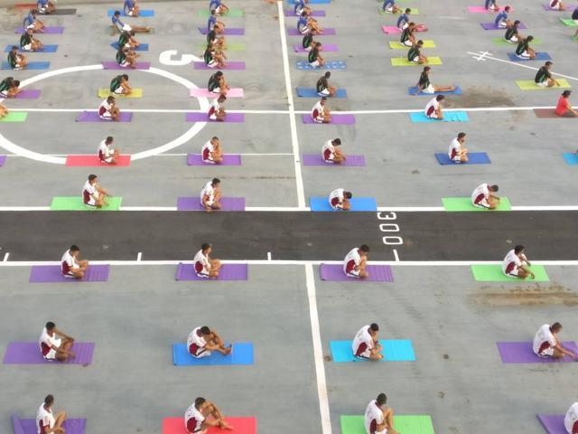 An aerial view of Navy officers taking part in a yoga session on INS Virat. (Pratik Chorge/HT Photo)