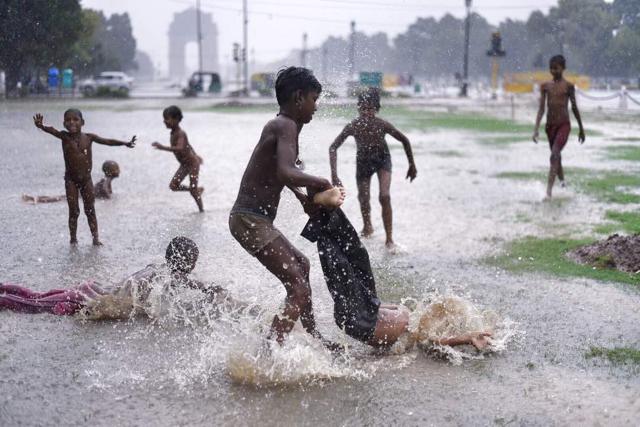 Children play in the rain on Wednesday in Delhi. MeT department is yet to confirm if Monsoon will keep its date with Delhi. (Arun Sharma / HT Photo) Children play in the rain on Wednesday in Delhi. MeT department is yet to confirm if Monsoon will keep its date with Delhi. (Arun Sharma / HT Photo)