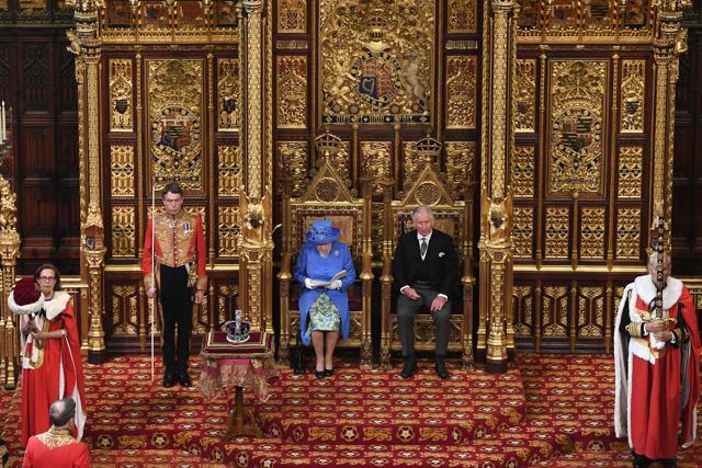 Queen Elizabeth II sits alongside her son Prince Charles as she delivers the Queen's Speech during the state opening of Parliament in London on June 21, 2017. The Queen formally announced the British government's legislative programme. The state opening, a ceremony full of pomp in which the monarch reads out the Queen's Speech detailing the government's programme for the coming year, was due to take place on June 19 but was delayed after Prime Minister Theresa May's Conservative Party lost its majority in the House of Commons in the June 8 election. (AFP) Queen Elizabeth II sits alongside her son Prince Charles as she delivers the Queen's Speech during the state opening of Parliament in London on June 21, 2017. The Queen formally announced the British government's legislative programme. The state opening, a ceremony full of pomp in which the monarch reads out the Queen's Speech detailing the government's programme for the coming year, was due to take place on June 19 but was delayed after Prime Minister Theresa May's Conservative Party lost its majority in the House of Commons in the June 8 election. (AFP)