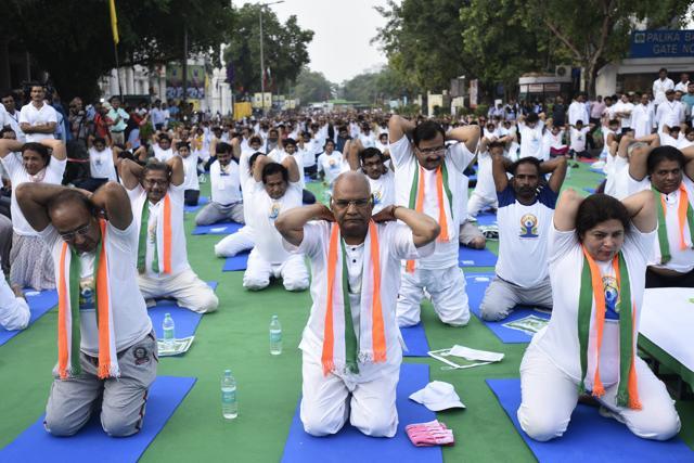 NDA's presidential candidate Ram Nath Kovind (C), Union minister Vijay Goel and Member of Parliament Meenakshi Lekhi during International Day of Yoga celebrations at Connaught Place, in New Delhi, on Wednesday, June 21, 2017. (Burhaan Kinu/HT PHOTO) NDA's presidential candidate Ram Nath Kovind (C), Union minister Vijay Goel and Member of Parliament Meenakshi Lekhi during International Day of Yoga celebrations at Connaught Place, in New Delhi, on Wednesday, June 21, 2017. (Burhaan Kinu/HT PHOTO)