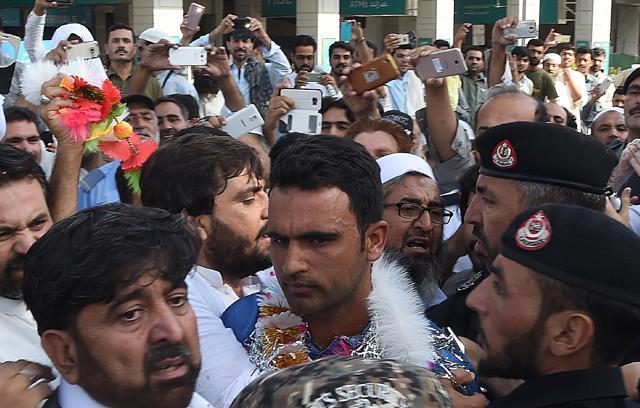 Pakistani cricketer Fakhar Zaman (C) is surrounded by fans as he arrives from London outside the Bacha Khan International airport in Peshawar on June 20 after Pakistan's win in the ICC Champions Trophy final against India. (AFP) Pakistani cricketer Fakhar Zaman (C) is surrounded by fans as he arrives from London outside the Bacha Khan International airport in Peshawar on June 20 after Pakistan's win in the ICC Champions Trophy final against India. (AFP)