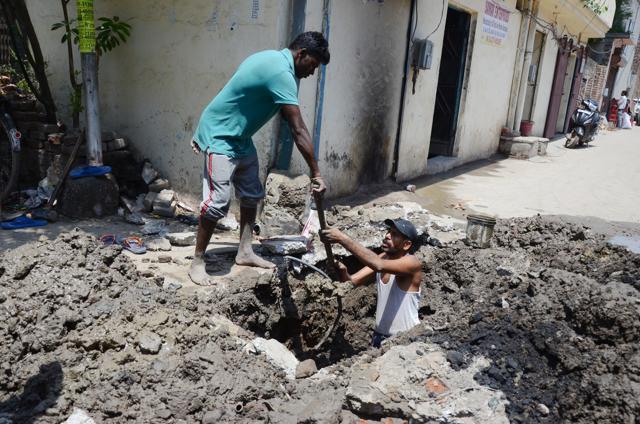 Municipal corporation staff inspecting water pipeline at Makkar Colony on Friday. (Jagtinder Singh Grewal /HT Photo) Municipal corporation staff inspecting water pipeline at Makkar Colony on Friday. (Jagtinder Singh Grewal /HT Photo)