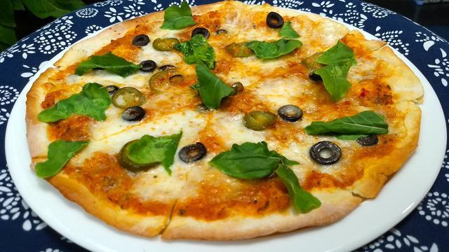The house specialty Port pizza (Rs 400) is a generous 12-inch and is served with dollops of mozzarella topped with arugula, jalapeno and olives. (Karthika Ganesh) The house specialty Port pizza (Rs 400) is a generous 12-inch and is served with dollops of mozzarella topped with arugula, jalapeno and olives. (Karthika Ganesh)