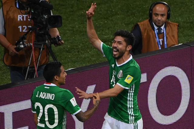 Mexico's forward Oribe Peralta (R) celebrates with Mexico's midfielder Javier Aquino after scoring a goal. (AFP) Mexico's forward Oribe Peralta (R) celebrates with Mexico's midfielder Javier Aquino after scoring a goal. (AFP)