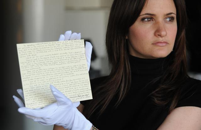 A member of staff at Waterstones holds a story written by JK Rowling donated by the author, for the What's Your Story? auction in aid of English PEN and Dyslexia Action, in London. (AP) A member of staff at Waterstones holds a story written by JK Rowling donated by the author, for the What's Your Story? auction in aid of English PEN and Dyslexia Action, in London. (AP)