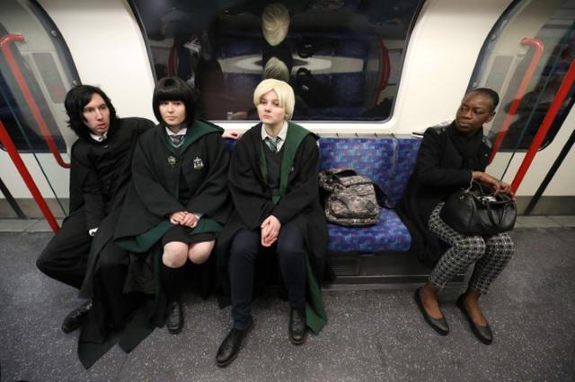 Cosplay fans (L-R) George Massingham, Abbey Forbes and Karolina Goralik travel by tube dressed in Harry Potter themed costumes, after a visit to one the literary franchise's movie filming locations at Leadenhall Market in London, Britain. (Reuters) Cosplay fans (L-R) George Massingham, Abbey Forbes and Karolina Goralik travel by tube dressed in Harry Potter themed costumes, after a visit to one the literary franchise's movie filming locations at Leadenhall Market in London, Britain. (Reuters)