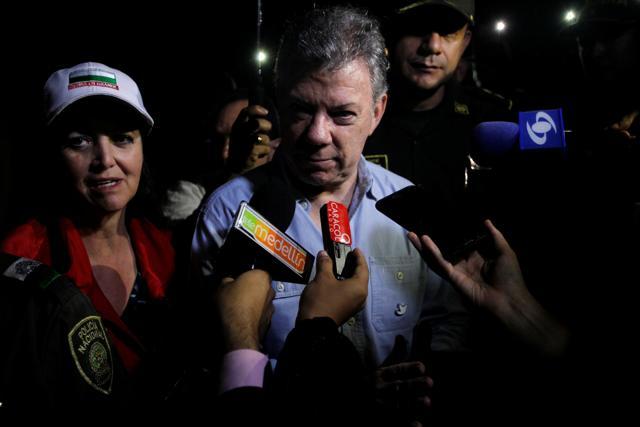 Colombian President Juan Manuel Santos arrives at the spot where a tourist boat sank (Reuters ) Colombian President Juan Manuel Santos arrives at the spot where a tourist boat sank (Reuters )