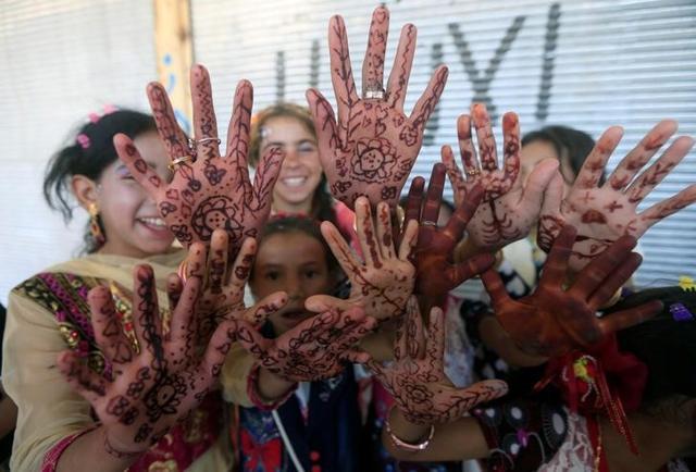 Displaced Iraqi girls who fled their homes pose as they celebrate Eid al-Fitr, in Mosul. (Reuters) Displaced Iraqi girls who fled their homes pose as they celebrate Eid al-Fitr, in Mosul. (Reuters)