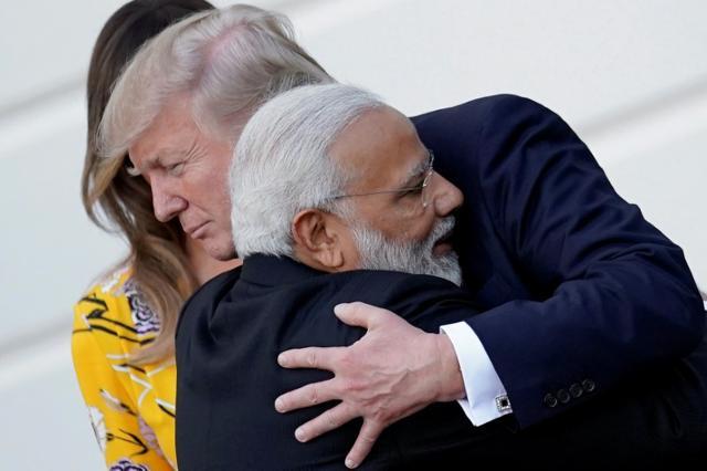 PM Modi hugs Donald Trump as he departures the White House after a visit, in Washington. (Reuters Photo) PM Modi hugs Donald Trump as he departures the White House after a visit, in Washington. (Reuters Photo)