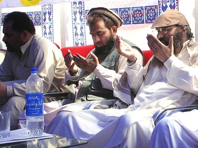 In this June 28, 2008 photo, suspected Pakistani mastermind of the 2008 Mumbai attacks, Zaki-ur-Rehman Lakhvi, prays with Syed Salahuddin, chief of Hizbul Mujahideen at a rally in Muzaffarabad in Pakistan-occupied Kashmir. (AP File Photo) In this June 28, 2008 photo, suspected Pakistani mastermind of the 2008 Mumbai attacks, Zaki-ur-Rehman Lakhvi, prays with Syed Salahuddin, chief of Hizbul Mujahideen at a rally in Muzaffarabad in Pakistan-occupied Kashmir. (AP File Photo)