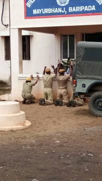 Four home guards, including a woman, were seen kneeling down, and the phot went viral on social media. (HT Photo) Four home guards, including a woman, were seen kneeling down, and the phot went viral on social media. (HT Photo)