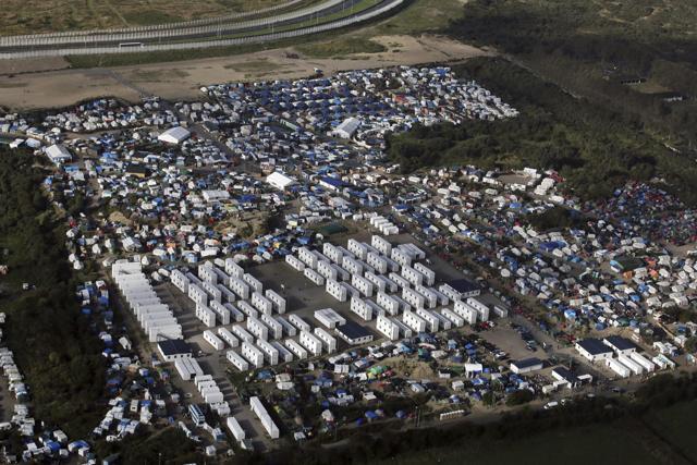 An aerial view of the makeshift migrant camp near Calais, France. (AP File Photo) An aerial view of the makeshift migrant camp near Calais, France. (AP File Photo)