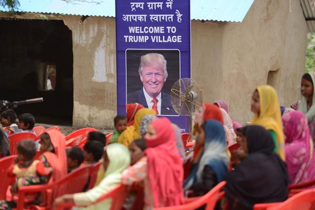 Women gather to listen to a speaker next to a poster with the image of US President Donald Trump during a ceremony at Marora village, which has been unofficially renamed 'Trump Village," on June 23, 2017. (AFP) Women gather to listen to a speaker next to a poster with the image of US President Donald Trump during a ceremony at Marora village, which has been unofficially renamed 'Trump Village," on June 23, 2017. (AFP)
