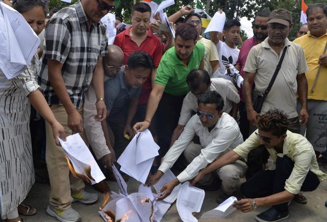 Supporters of the Gorkha Janmukti Morcha (GJM) burn copies of the Gorkhaland Territorial Administration (GTA) agreement during a protest in Dagapur village on the outskirts of Siliguri on June 27, 2017. (AFP) Supporters of the Gorkha Janmukti Morcha (GJM) burn copies of the Gorkhaland Territorial Administration (GTA) agreement during a protest in Dagapur village on the outskirts of Siliguri on June 27, 2017. (AFP)