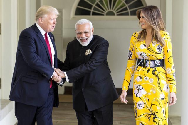 Prime Minister Narendra Modi (C) with US President Donald Trump and the first lady of US Melania Trump at White House. (PTI Photo) Prime Minister Narendra Modi (C) with US President Donald Trump and the first lady of US Melania Trump at White House. (PTI Photo)