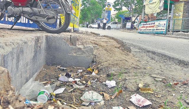 The roadside drains have been virtually blocked at several places. (HT Photo) The roadside drains have been virtually blocked at several places. (HT Photo)