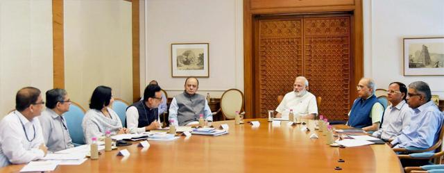 Prime Minister Narendra Modi reviewing the status of GST in New Delhi on June 26, 2017. Finance Minister Arun Jaitley is also seen. (PTI) Prime Minister Narendra Modi reviewing the status of GST in New Delhi on June 26, 2017. Finance Minister Arun Jaitley is also seen. (PTI)
