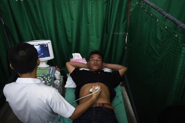 A man gets an ultrasound during a CASCAP (Cholangiocarcinoma Screening and Care Program) event in the northeastern Thai province of Kalasin. (AFP) A man gets an ultrasound during a CASCAP (Cholangiocarcinoma Screening and Care Program) event in the northeastern Thai province of Kalasin. (AFP)