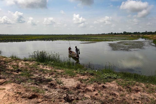 Farmers fishing in a lotus lake in the northeastern Thai province of Khon Kaen. (AFP) Farmers fishing in a lotus lake in the northeastern Thai province of Khon Kaen. (AFP)