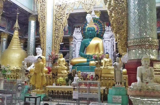 Beautifully arranged bouquets and sculptures adorn the central idol of Lord Buddha (Yamini Nair) Beautifully arranged bouquets and sculptures adorn the central idol of Lord Buddha (Yamini Nair)