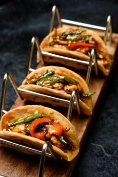 Pepper Chilli chicken, Ajwaini Tawa Parantha Tacos by Chef Harangad Singh of Prankster, Gurugram. He says, “These fusion tacos bring the nostalgic taste of Ajwaini Tawa parantha of your grandmother taste. The chilli chicken used is tossed with pepper and spices”. Pepper Chilli chicken, Ajwaini Tawa Parantha Tacos by Chef Harangad Singh of Prankster, Gurugram. He says, “These fusion tacos bring the nostalgic taste of Ajwaini Tawa parantha of your grandmother taste. The chilli chicken used is tossed with pepper and spices”.