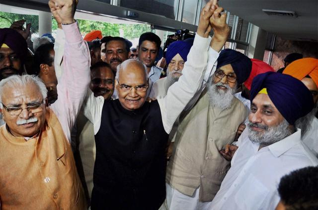 NDA presidential candidate Ram Nath Kovind (C) with the former Punjab chief minister Parkash Singh Badal and Haryana CM Manohar Lal Khattar. (PTI) NDA presidential candidate Ram Nath Kovind (C) with the former Punjab chief minister Parkash Singh Badal and Haryana CM Manohar Lal Khattar. (PTI)
