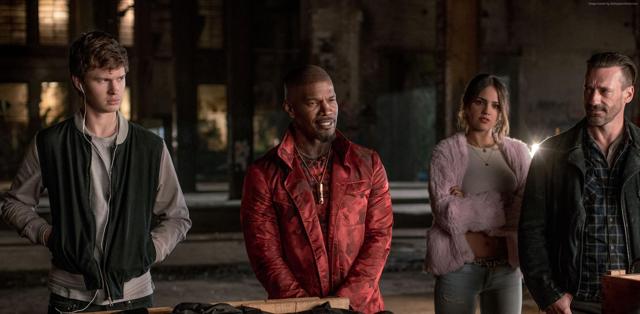 There are several killer action scenes, such as an illegal arms deal, which provide an adrenaline jolt. In supporting roles of trigger-happy henchmen, Jon Hamm (right) and Jamie Foxx (centre) are standouts.