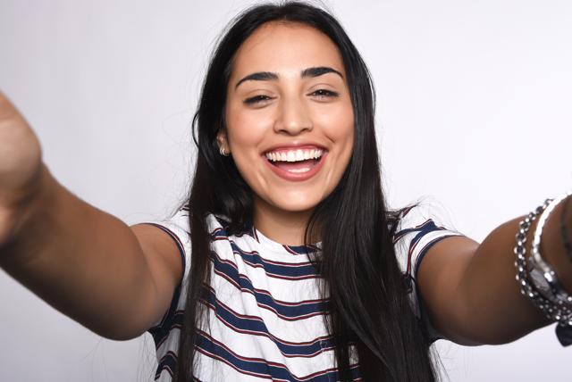 Smiles were rated as more successful if they developed quite symmetrically, with the left and right side of the faces. (Shutterstock )