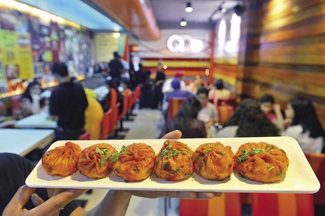 In North India, tandoori momos, like those at QD’s in New Delhi, are a common variation (Getty Images) In North India, tandoori momos, like those at QD’s in New Delhi, are a common variation (Getty Images)