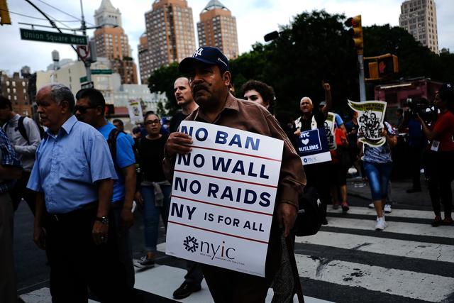 Recent Immingrants join activists for an evening protest in Manhattan hours before a revised version of President Donald Trump's travel ban. (AFP) Recent Immingrants join activists for an evening protest in Manhattan hours before a revised version of President Donald Trump's travel ban. (AFP)