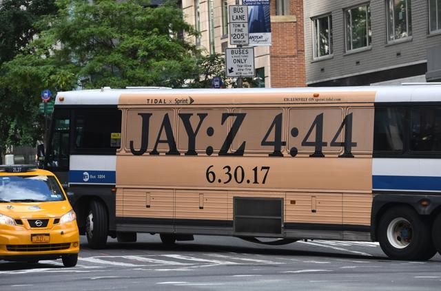 A New York City bus with an advertisement for Jay-Z's anticipated new album 4:44 turns a corner in midtown. (AFP) A New York City bus with an advertisement for Jay-Z's anticipated new album 4:44 turns a corner in midtown. (AFP)