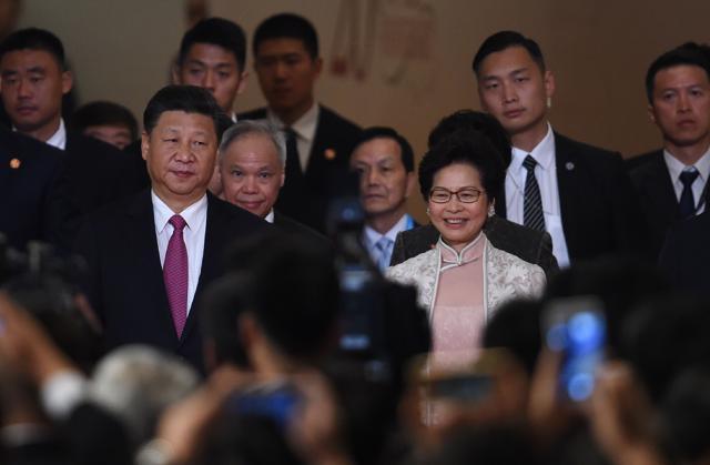 Hong Kong's new Chief Executive Carrie Lam (centre R) arrives with China's President Xi Jinping (front L) before being sworn in as the territory's new leader at the Hong Kong Convention and Exhibition Centre in Hong Kong on July 1, 2017. (AFP) Hong Kong's new Chief Executive Carrie Lam (centre R) arrives with China's President Xi Jinping (front L) before being sworn in as the territory's new leader at the Hong Kong Convention and Exhibition Centre in Hong Kong on July 1, 2017. (AFP)