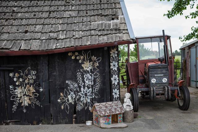 Farm buildings covered with traditional flower patterns. (AFP) Farm buildings covered with traditional flower patterns. (AFP)