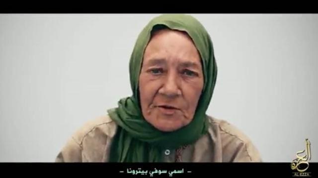 This undated frame grab from video, posted online by recently formed militant group Nusrat al-Islam wal Muslimeen, shows hostage Sophie Petronin of France in an unknown location, with a caption reading in Arabic 'My name is Sophie Petronin.'  (AP)