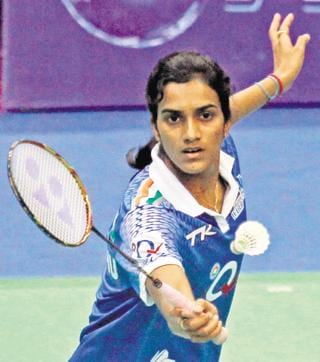 Olympian Indian shuttler PV Sindhu thrashes during a match at the Shri Shiv Chhatrapati Shivaji Stadium in Pune in August 2013.  (HT file photo)