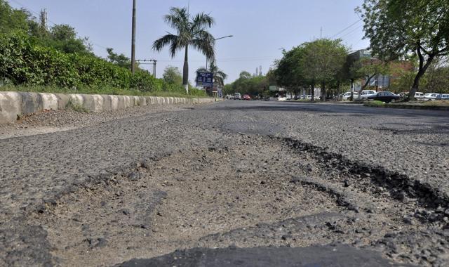 The road dividing the Sectors 5 and 9 in a dilapidated condition. Other roads are also potholed, increasing the risk of accidents in Panchkula. (Sant Arora/HT) The road dividing the Sectors 5 and 9 in a dilapidated condition. Other roads are also potholed, increasing the risk of accidents in Panchkula. (Sant Arora/HT)